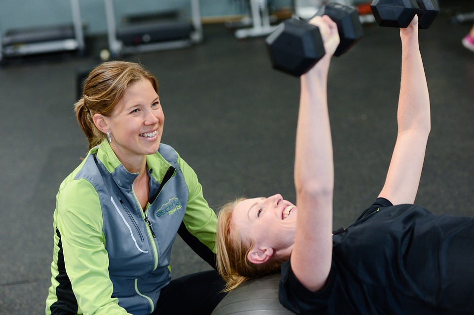 fitness trainer with her trainee