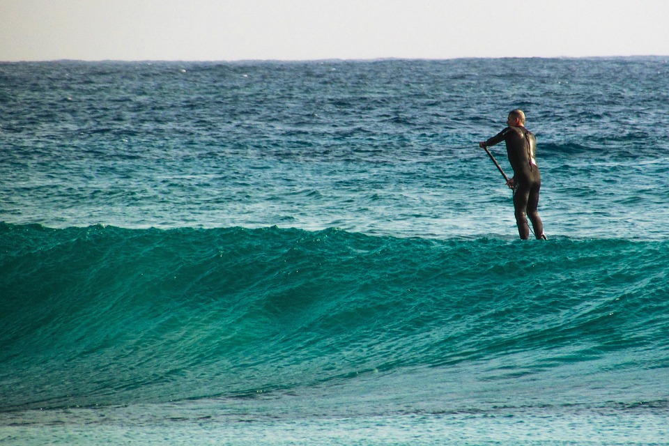 man paddle boarding
