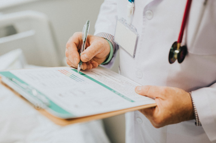 a doctor holding medical records